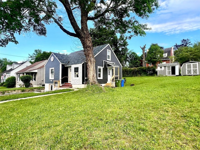 8-10 Mercer St, Middletown, NY 10940 - view of front of house with a shed, a front yard, and entry steps