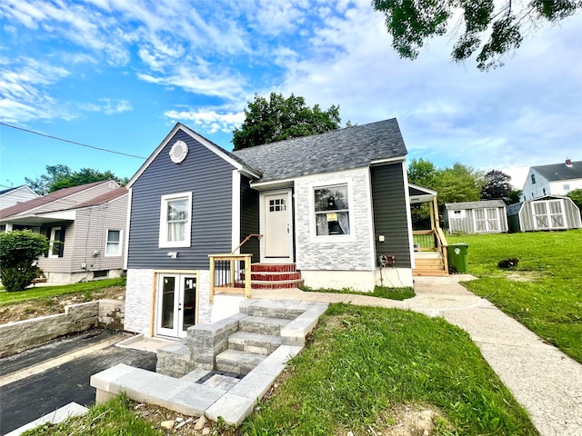 8-10 Mercer St, Middletown, NY 10940 - bungalow featuring french doors, a shed, a front yard, and stone siding
