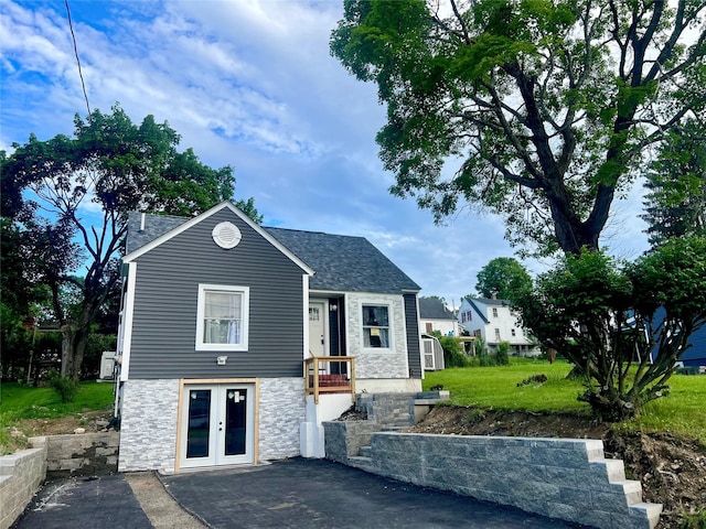 8-10 Mercer St, Middletown, NY 10940 - view of front of property featuring stone siding, french doors, and roof with shingles