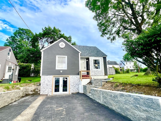 8-10 Mercer St, Middletown, NY 10940 - bungalow-style house with french doors, stone siding, and a shed