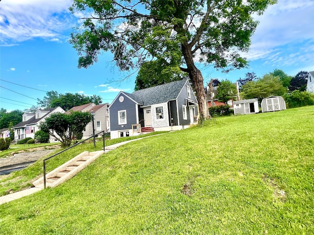 8-10 Mercer St, Middletown, NY 10940 - view of front facade with a storage unit, a front lawn, a residential view, and entry steps