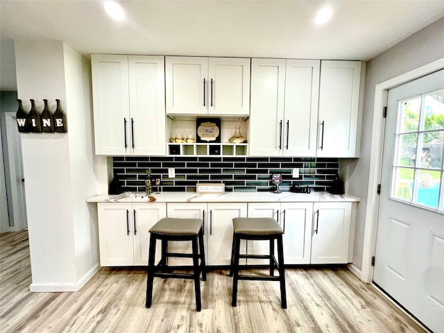 8-10 Mercer St, Middletown, NY 10940 - kitchen with white cabinets, tasteful backsplash, light wood-type flooring, open shelves, and recessed lighting