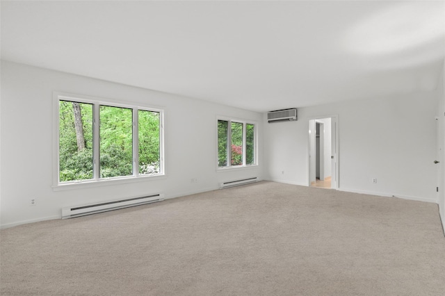 unfurnished room with a baseboard heating unit, an AC wall unit, light carpet, and baseboards