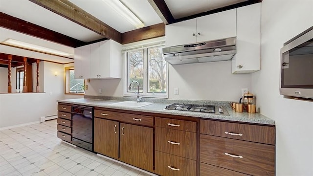 kitchen with baseboard heating, a sink, beamed ceiling, appliances with stainless steel finishes, and under cabinet range hood