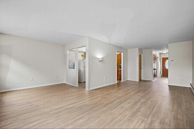 75 Vails Gate Heights Dr, Vails Gate, NY 12553 - unfurnished living room with wood finished floors and baseboards