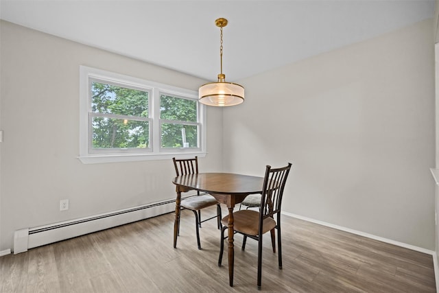 75 Vails Gate Heights Dr, Vails Gate, NY 12553 - dining room with baseboard heating, baseboards, and wood finished floors