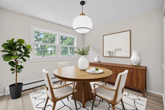 75 Vails Gate Heights Dr, Vails Gate, NY 12553 - dining room with light wood finished floors, a baseboard radiator, and baseboards