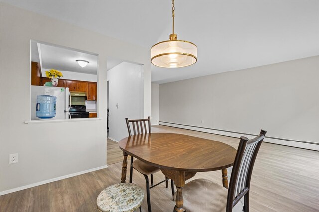 75 Vails Gate Heights Dr, Vails Gate, NY 12553 - dining space with light wood-type flooring and baseboards