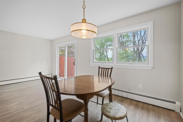 75 Vails Gate Heights Dr, Vails Gate, NY 12553 - dining room featuring a baseboard radiator and wood finished floors