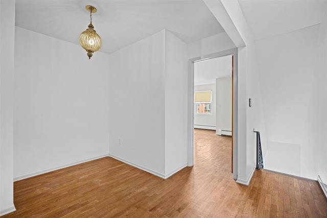 75 Vails Gate Heights Dr, Vails Gate, NY 12553 - unfurnished room with a baseboard heating unit, wood finished floors, a baseboard radiator, and baseboards
