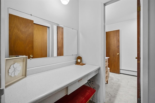 75 Vails Gate Heights Dr, Vails Gate, NY 12553 - bathroom featuring baseboard heating, marble finish flooring, and vanity
