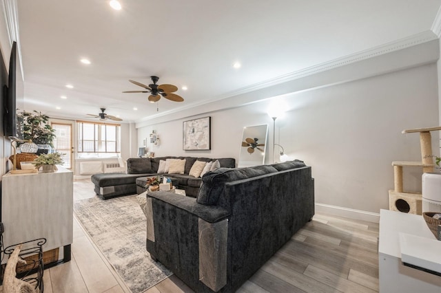 700 Shore Rd Unit 2Z, Long Beach, NY 11561 - living room featuring crown molding, a ceiling fan, light wood-style flooring, baseboards, and recessed lighting