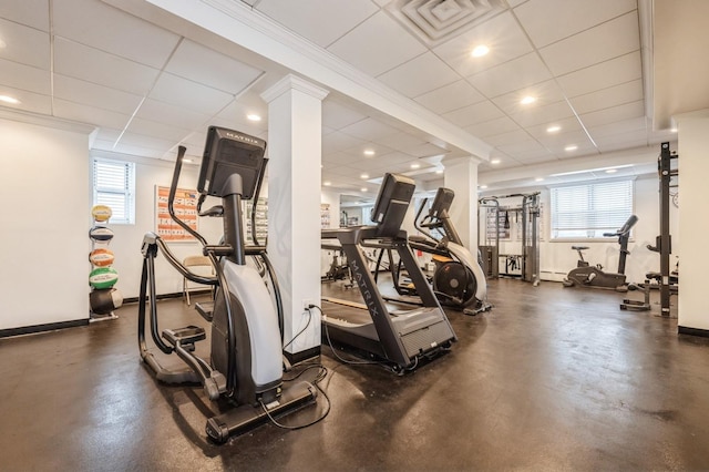 700 Shore Rd Unit 2Z, Long Beach, NY 11561 - exercise area with baseboards, ornate columns, a drop ceiling, and a baseboard heating unit