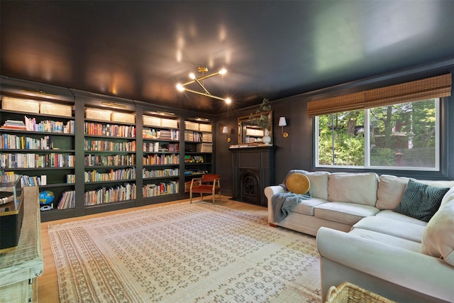living area with wood finished floors and a chandelier