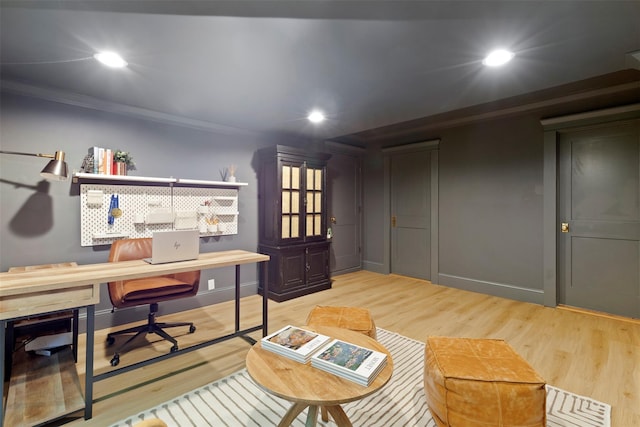 home office featuring recessed lighting, ornamental molding, and light wood-style flooring