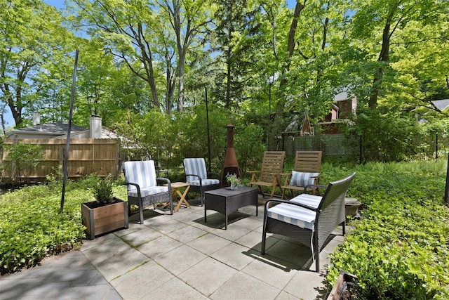 view of patio featuring fence