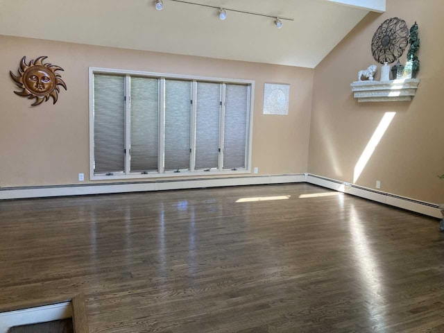 unfurnished living room featuring a baseboard radiator, wood finished floors, lofted ceiling, and baseboards