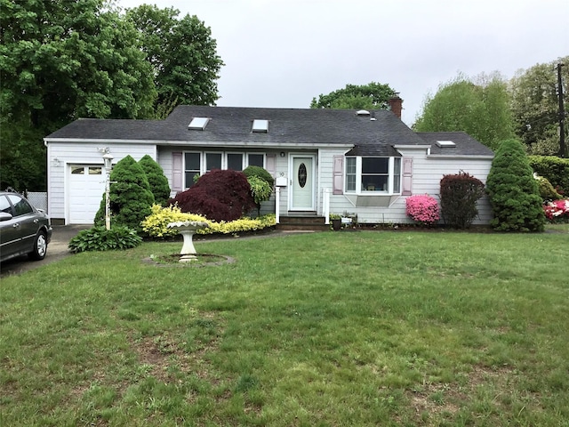 ranch-style home featuring a garage, entry steps, a front lawn, and a chimney