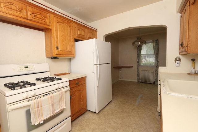 22 Primrose Dr, New Hyde Park, NY 11040 - kitchen with white appliances, radiator heating unit, brown cabinetry, light countertops, and light flooring