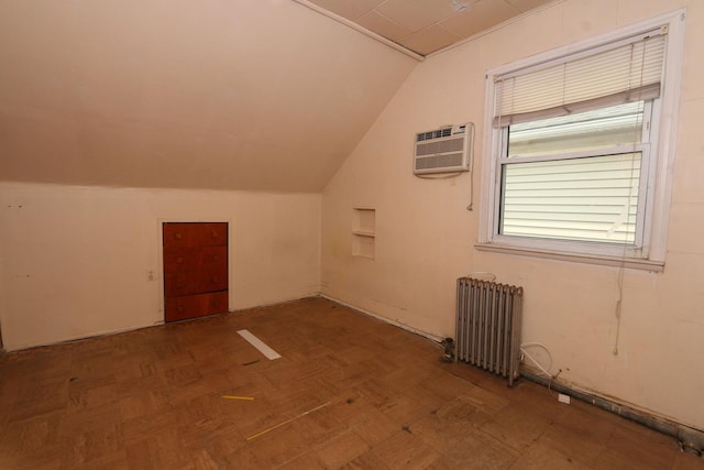 22 Primrose Dr, New Hyde Park, NY 11040 - bonus room with radiator, vaulted ceiling, and a wall unit AC