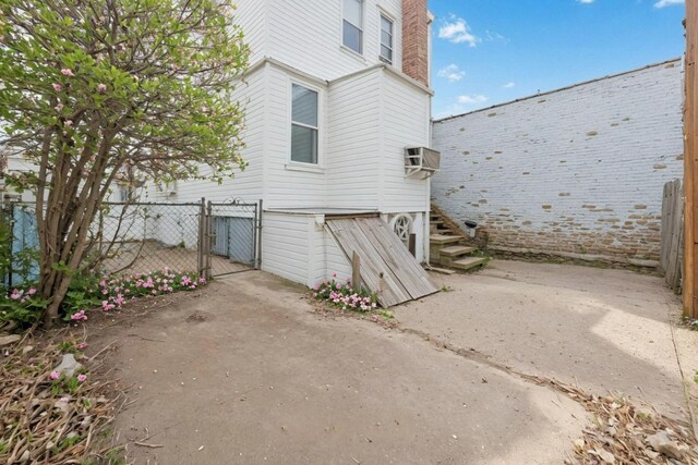 6107 Grand Ave, Maspeth, NY 11378 - view of property exterior featuring a gate