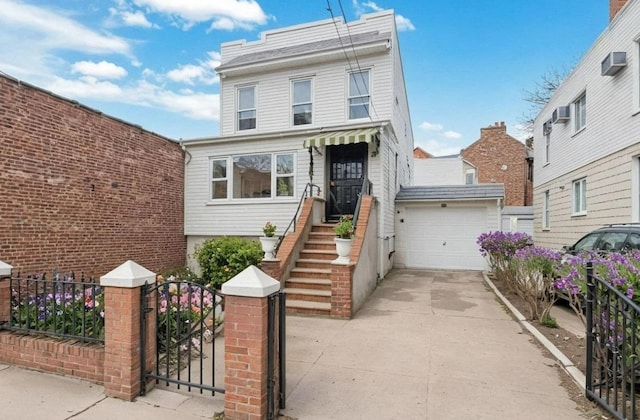 6107 Grand Ave, Maspeth, NY 11378 - view of front of house featuring a garage, driveway, and a gate