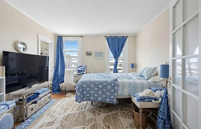 6107 Grand Ave, Maspeth, NY 11378 - bedroom with ornamental molding and wood finished floors