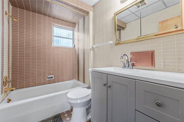 6107 Grand Ave, Maspeth, NY 11378 - full bath with tile walls, toilet, vanity, and washtub / shower combination