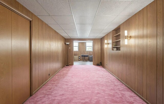 6107 Grand Ave, Maspeth, NY 11378 - hallway with wood walls, carpet, and built in features
