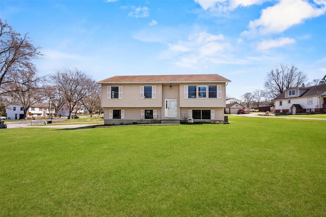 view of front facade with a front yard and entry steps