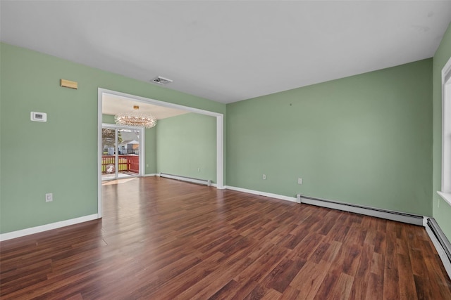 empty room featuring visible vents, a baseboard radiator, baseboard heating, a baseboard heating unit, and a notable chandelier