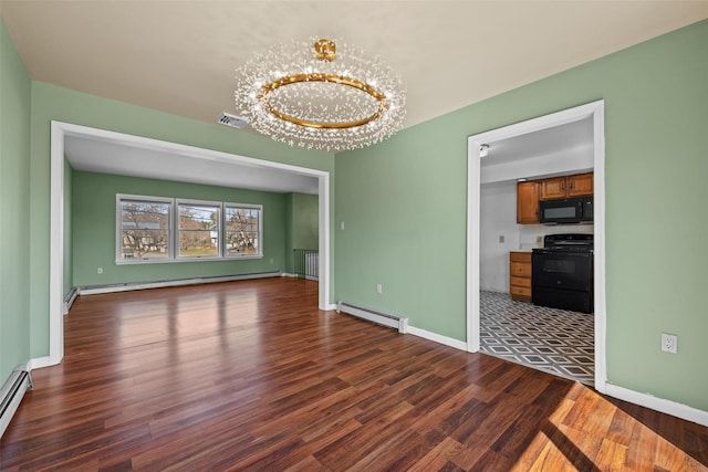 unfurnished room with visible vents, a chandelier, a baseboard radiator, wood finished floors, and a baseboard heating unit