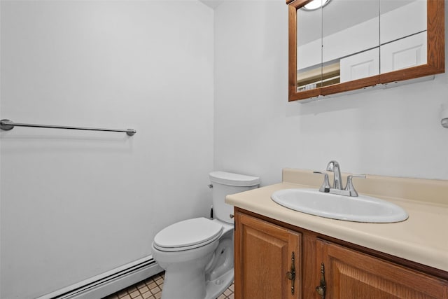 bathroom featuring toilet, vanity, and a baseboard radiator