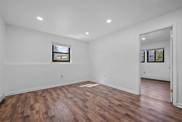 unfurnished room featuring wood finished floors, recessed lighting, and plenty of natural light