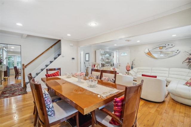 dining space with stairs, light wood finished floors, recessed lighting, and crown molding
