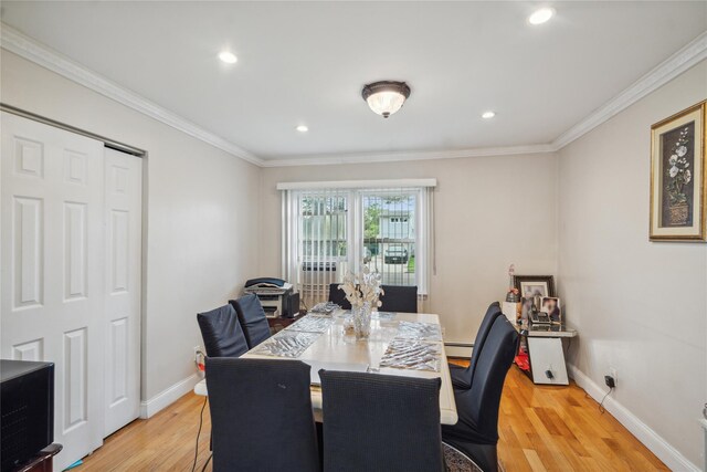 dining room with light wood finished floors, baseboards, recessed lighting, ornamental molding, and baseboard heating