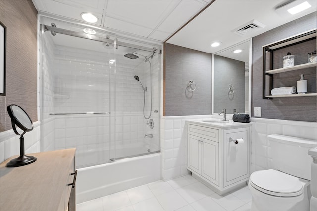 100 Harbor View Dr Unit 230, Port Washington, NY 11050 - full bathroom featuring vanity, bath / shower combo with glass door, tile patterned flooring, wainscoting, and recessed lighting