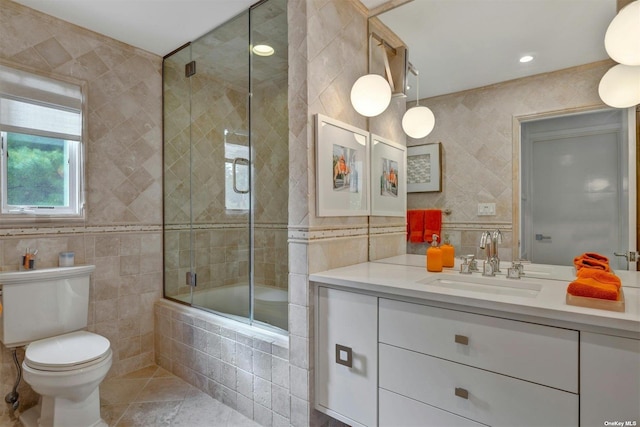 33 Old Canoe Place Rd, Hampton Bays, NY 11946 - full bath with tiled shower / bath combo, toilet, vanity, and tile walls