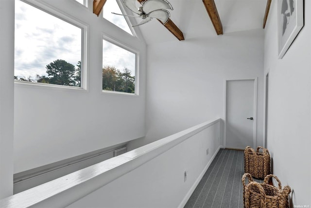 33 Old Canoe Place Rd, Hampton Bays, NY 11946 - hallway featuring lofted ceiling with beams, baseboards, and dark carpet
