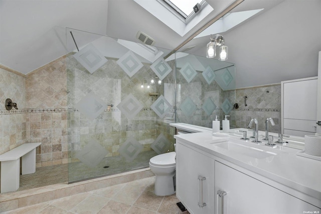 33 Old Canoe Place Rd, Hampton Bays, NY 11946 - full bathroom with tile walls, visible vents, a skylight, toilet, and vanity