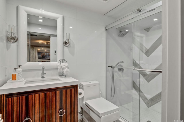 33 Old Canoe Place Rd, Hampton Bays, NY 11946 - bathroom with a shower stall, tile walls, toilet, and vanity