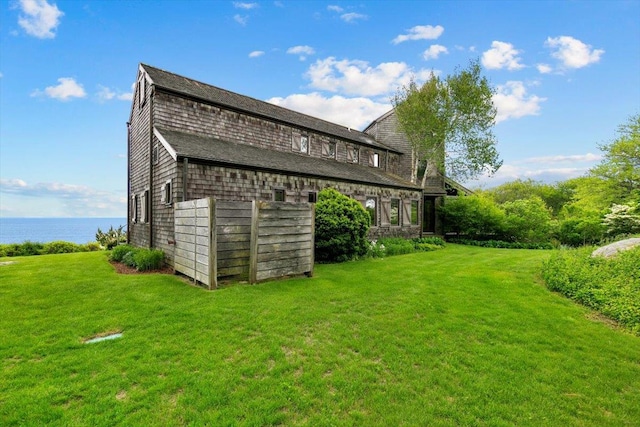 1635 Isabella Beach Rd, Fishers Island, NY 06390 - view of home's exterior with a lawn and a water view