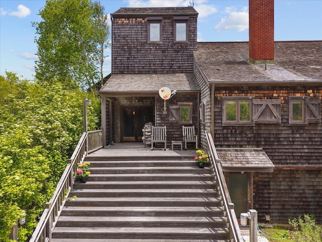 1635 Isabella Beach Rd, Fishers Island, NY 06390 - view of front of home with stairway and a chimney