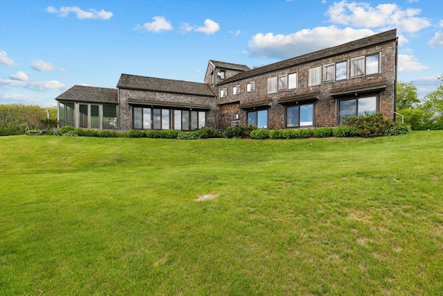 1635 Isabella Beach Rd, Fishers Island, NY 06390 - back of property with brick siding and a lawn