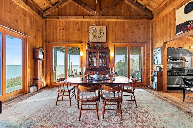 1635 Isabella Beach Rd, Fishers Island, NY 06390 - dining room with wood ceiling with exposed beams, high vaulted ceiling, wood walls, plenty of natural light, and wood-type flooring
