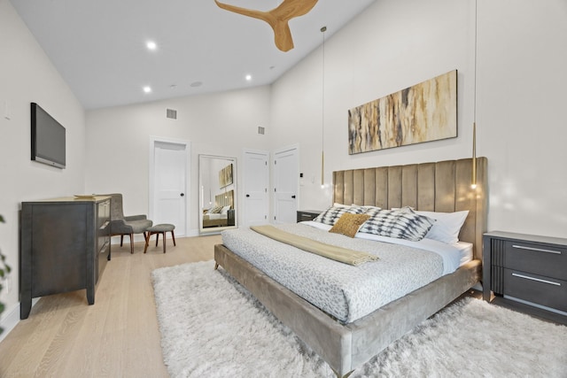 bedroom featuring high vaulted ceiling, a ceiling fan, wood finished floors, visible vents, and recessed lighting