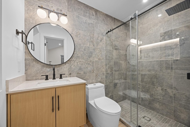 full bath featuring toilet, vanity, a shower stall, tasteful backsplash, and tile walls