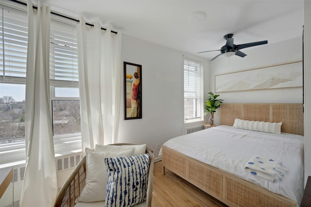 100 Dehaven Dr Unit 612, Yonkers, NY 10703 - bedroom with wood finished floors, baseboards, radiator, and ceiling fan