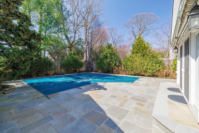 view of pool featuring a patio area, a fenced in pool, and a fenced backyard