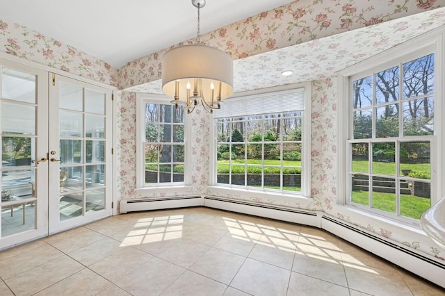 22 Druid Hill Rd, Port Jefferson, NY 11777 - unfurnished dining area with wallpapered walls, plenty of natural light, tile patterned flooring, and a chandelier